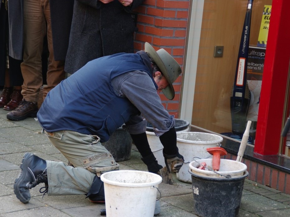 Gunter Demnig placing the first Stolpersteine in Aalten