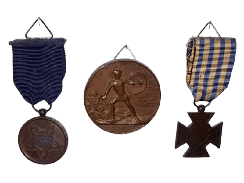 Decorations of Tonij Stapelkamp - Citadel Medal and the (large) named medal issued later by the Commission of Gratitude; on the right, the Bronze Cross of the Ten Days' Campaign.